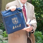 Mike True displays gifts received from China.